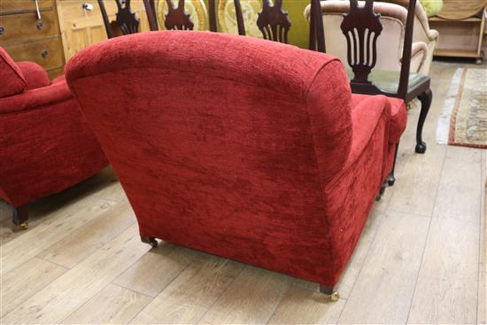 A near pair of red chenille Victorian armchairs